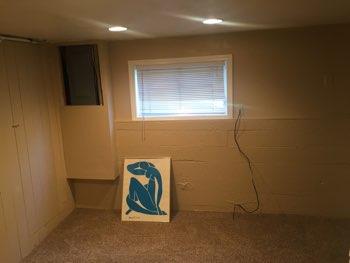 1. Family Room Basement Family Room Walls and ceilings appear in good condition overall. Flooring is carpet in good condition.