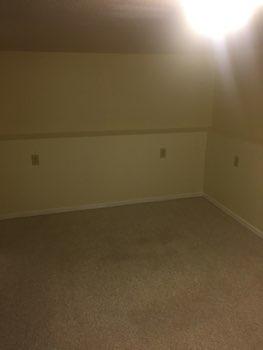1. Bedroom Room Basement Bedroom 2 Walls and ceilings appear in good condition overall.