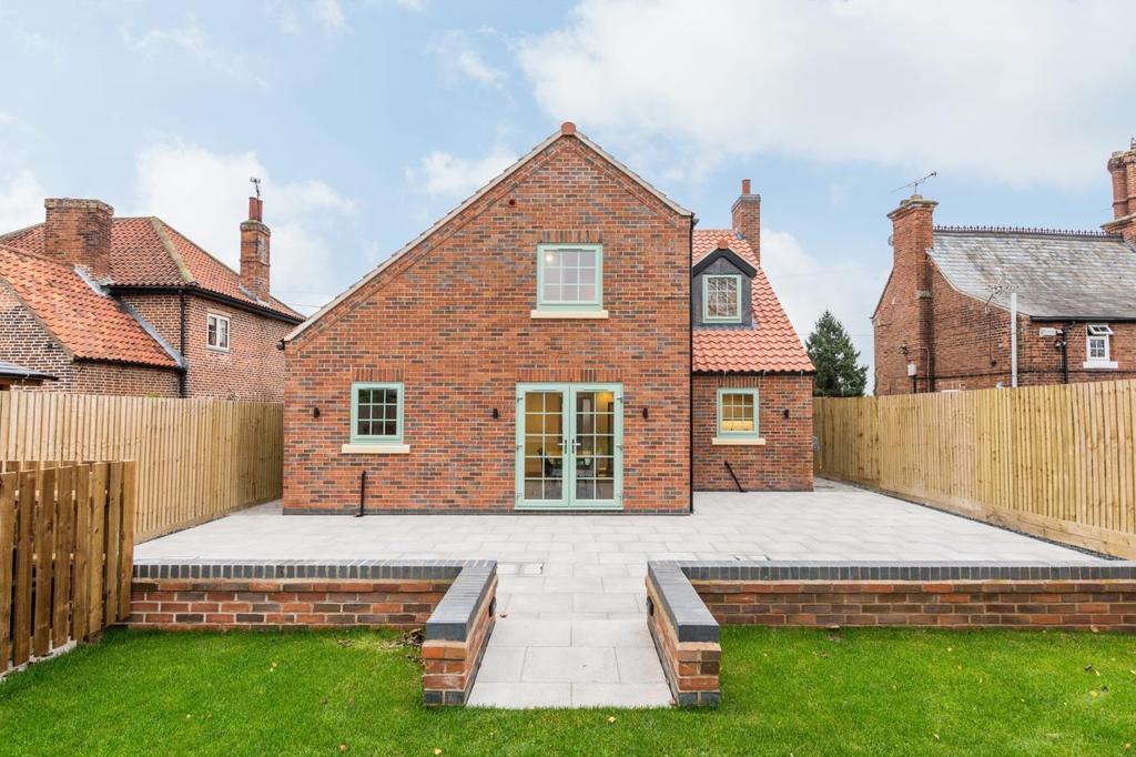 THE ORCHARD A stunning new build property reflecting the design of a small traditional village house combining well considered architecture with a 21 st Century internal specification of a high
