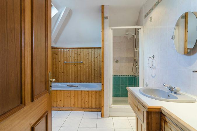 13m) BATHROOM: Comprising fully tiled shower cubicle with tongue and groove