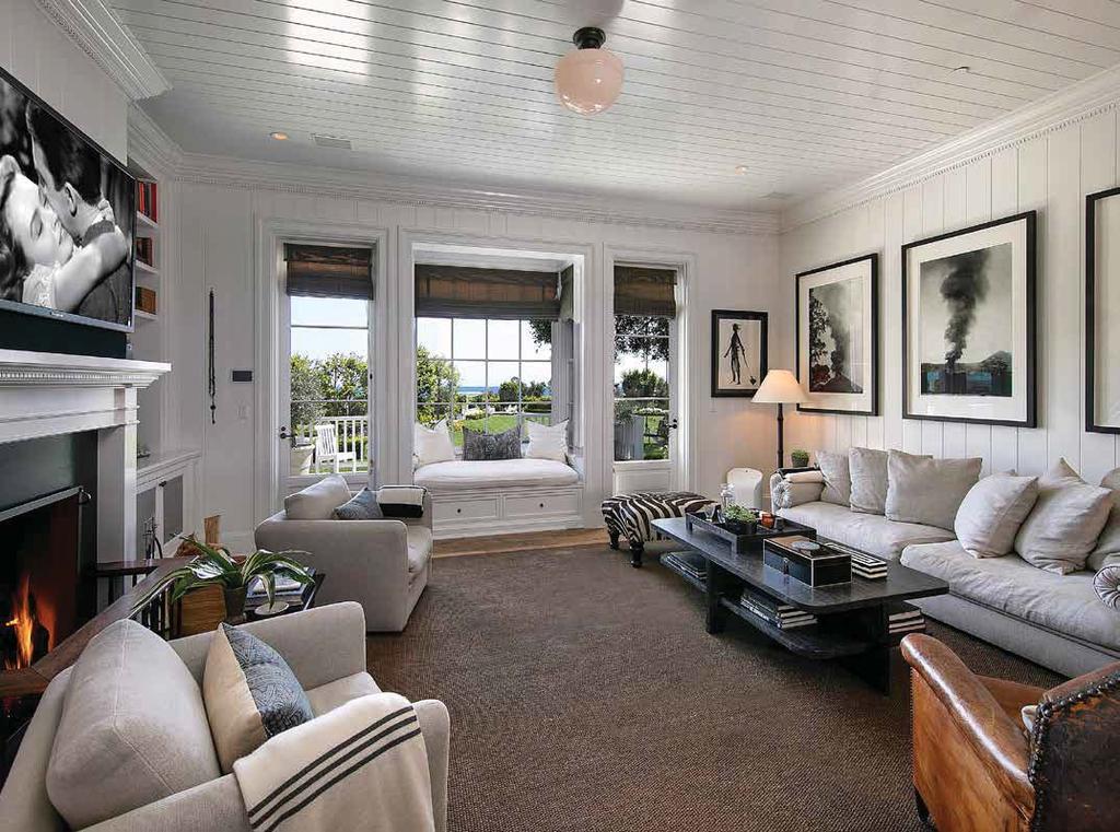 FAMILY & MORNING ROOMS The family room has a light and airy coastal feel, with a contrasting blackand-white palette,
