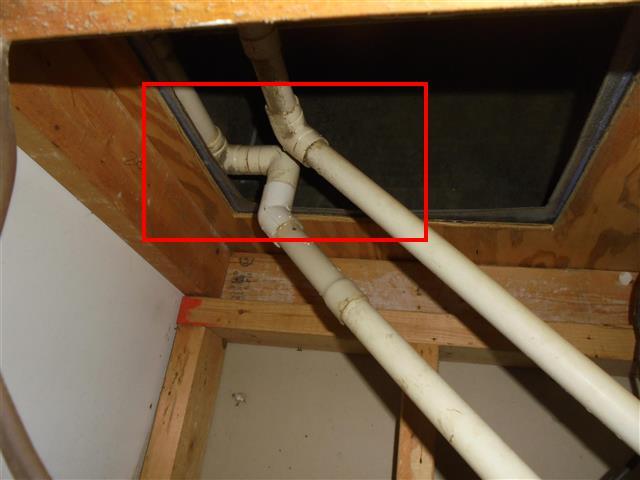 The coils are dripping; not all of the condensate water is making it into the main drain line.