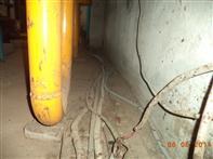 Non-Compliance Level: 1 Electrical wiring and conduit is not properly supported. Location: Substation Room, Generator Room. Photograph: Inadequate cable support.
