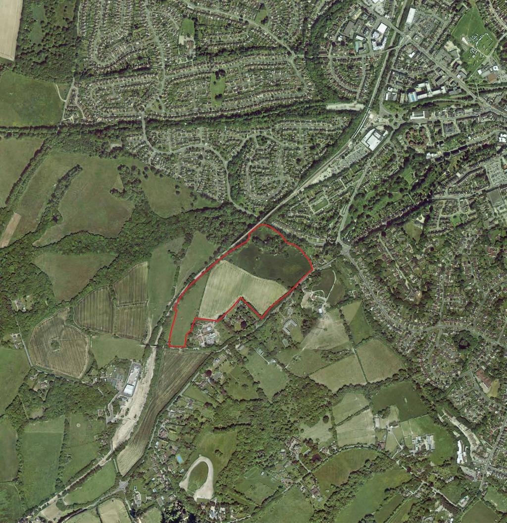 Site Background Situated on the south-western edge of East Grinstead, the site is bordered to the south by Turners Hill Road (B), to the north by the Bluebell Railway, to the west by open fields and