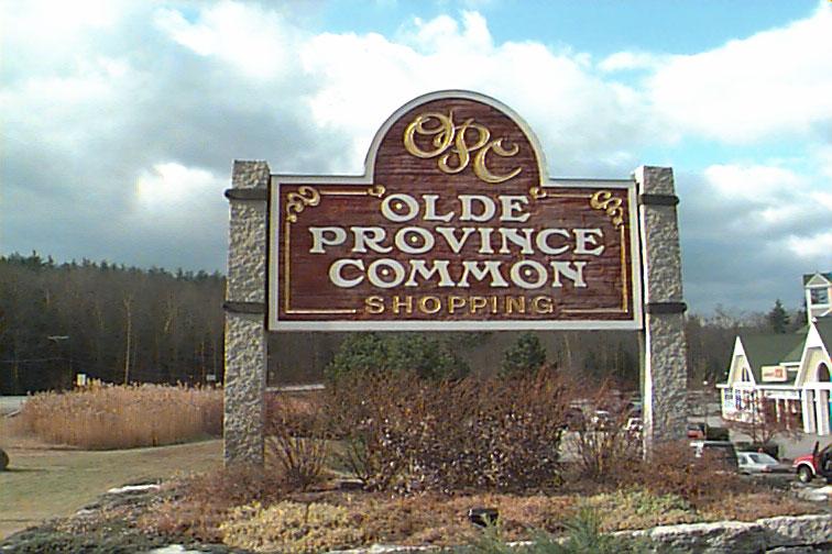 The sign for Olde Province Common (above, left) is designed in a style that is complementary to