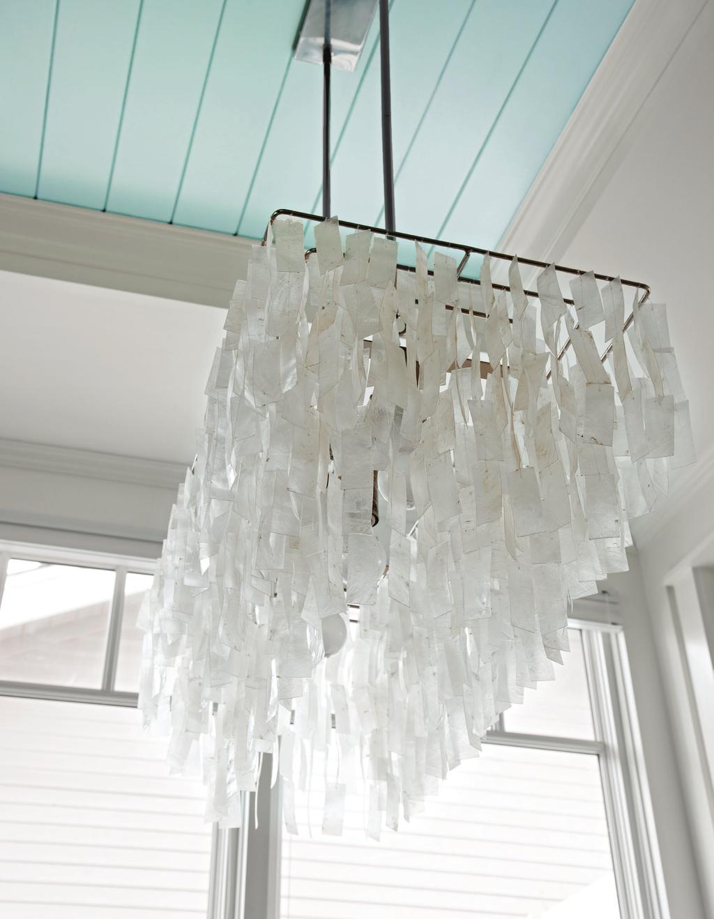 THIS PAGE: Susan loves the capiz shell chandelier above the dining table, which chimes softly in the California breeze when the kitchen s bifold window and door are open.