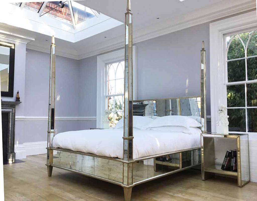 OBELISK The most romantic four poster bed in antiqued mirror with silver leaf trim, beautifully detailed finials and diamond feet completing the fine