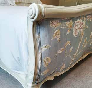 fine carving on the legs, headboard and footboard.