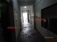 Exit discharge shall not reenter a building. Stair-02 terminates at ground floor in the corridor of the market.