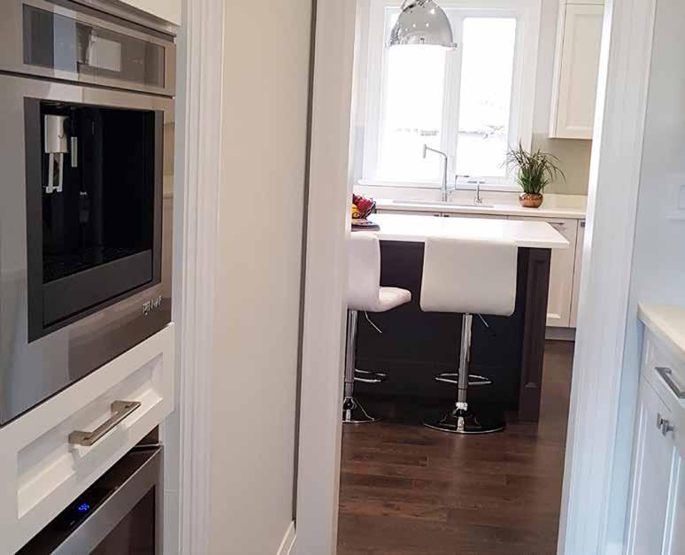 The custom, gourmet kitchen showcases a huge centre island with breakfast seating.