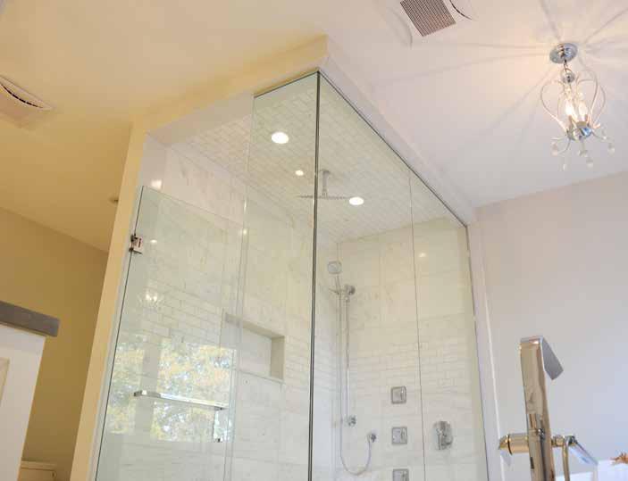 glass shower with rain and handheld showers, with