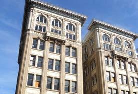 Common features among the historic buildings in the area include articulated facades made of brick, stone, and terra cotta.