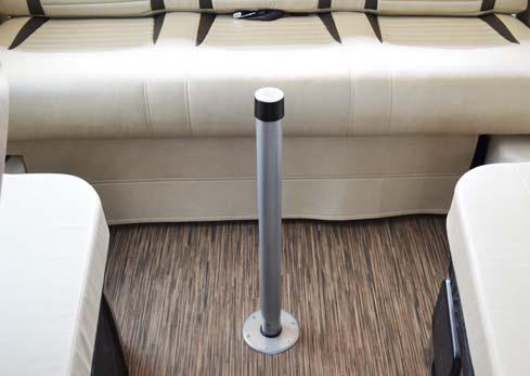 Place dinette table top securely on table leg.