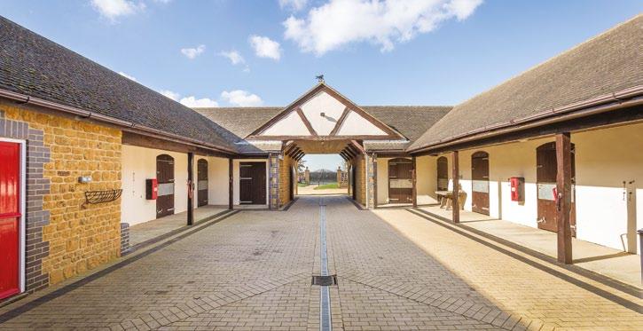 Hornton stone and is of a particularly high standard, including 9 stables, tack room, feed store, cloakroom, grooms cottage and floodlit all weather