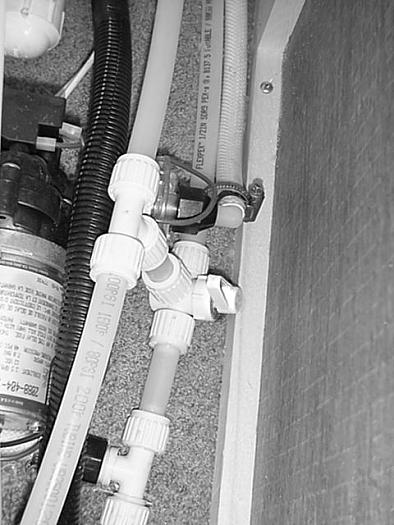 WATER LINE AND TANK DRAIN VALVES The water drain valves are used to drain water from the water tank and the water supply lines when preparing the motor home for storage or when sanitizing the water