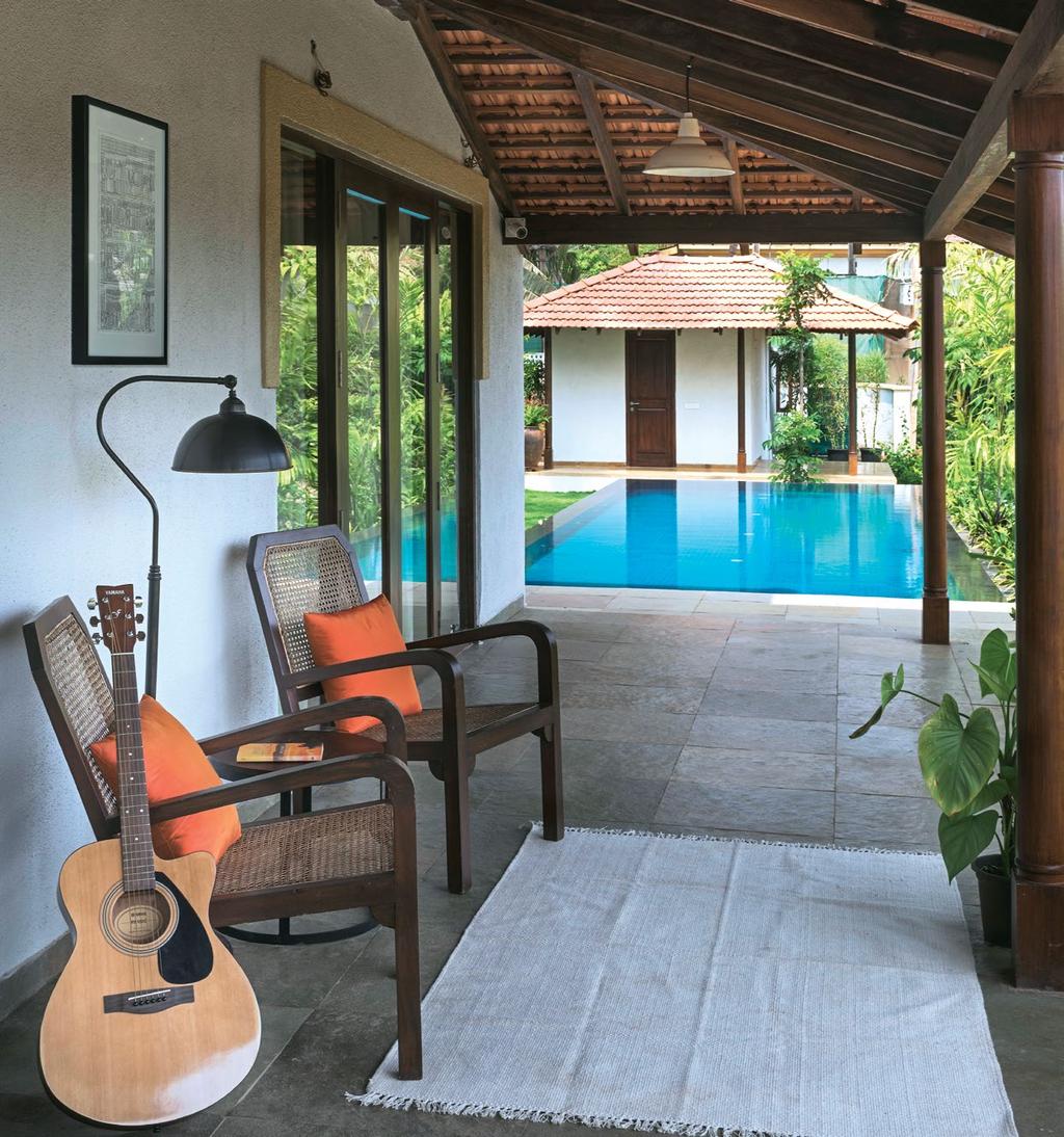 spaces Home The verandah near the pool sees use of natural tiles that