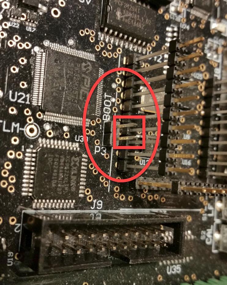 The BOOT jumper is located close to where the ribbon cable for the display plugs in. If the control is power cycled in this condition, the factory program will overwrite the existing running program.