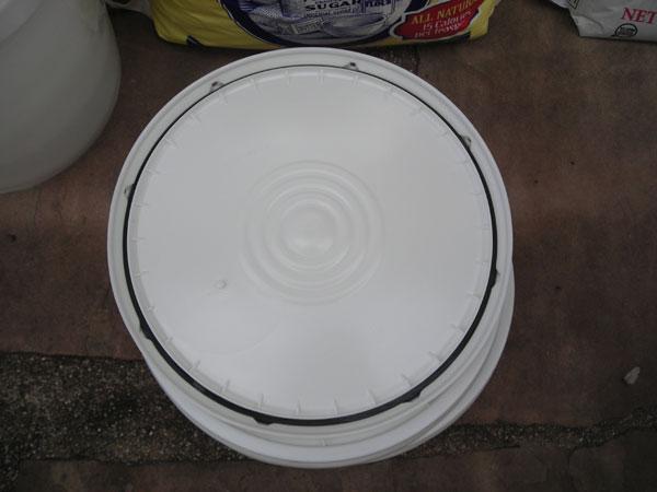 This picture shows the bucket lids I like to use. They are from U.S. Plastics and have a nice gasket seal.
