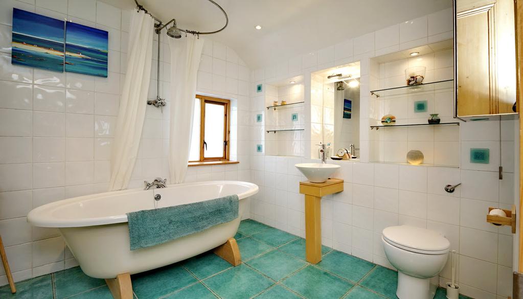 BATHROOM: White bathroom suite comprising free standing oval bath, Bristan thermostatic shower unit with rain shower head, low flush wc,