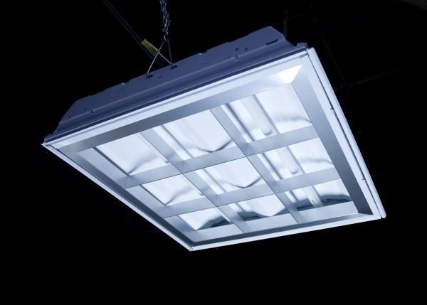 leaving only the fixture itself exposed. The ceiling-mounted version is often called a downlight.