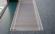 Trench heating is very discreet, frees up floor space and does not obscure vision through the glazing.