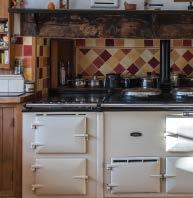 There is a well fitted custom built pine kitchen/breakfast room, which forms the heart of the home, with an Aga and plenty of space for a dining table.