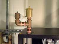 Follow the applicable codes and good piping practice. There are a number of boiler feed and pressurization devices on the market today that may be a better choice than a raw water fill from the mains.