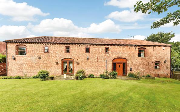 Church Barn, North Kelsey, Lincolnshire Lincoln - 25 miles Hull - 26 miles Dating from 1807 this impressive brick and pantile barn conversion of some 3,200 sq. ft.