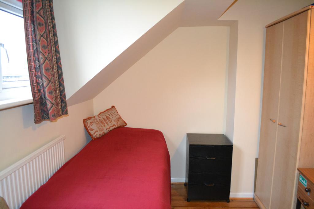 Bedroom 3: 11 2 x 8 10 ft. Stained polished floor boards. UPVC double glazed window overlooking the rear. Large radiator.