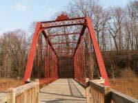 Riveted connections on a Pratt truss are uncommon in Michigan but common in other states. Only bridge in the park with riveted connections.