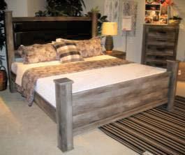 (57/B100-21) B440 Wynnlow Casual bedroom in a rustic gray replicated oak grain with an authentic touch Accented with large scaled dark colored hooded pulls Case