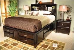 (82/94) Queen Sleigh Bed (81/96) B473 Kira (Ashley) Hardwood solids and veneers in almost black finish Shaped overlay drawer fronts Aged bronze colored hardware and beveled mirror Full bed also