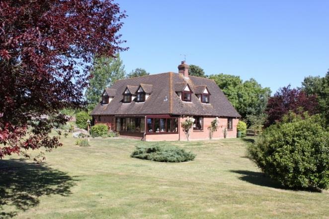 Popple Down Farm Lopcombe Salisbury Wiltshire SP5 1BW A substantial detached family house standing within beautiful gardens and grounds extending to in excess of three and a half acres, in a rural