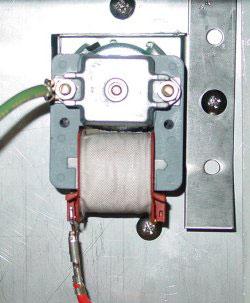 ) Unscrew two screws securing magnet to door. 3) Replace magnet catch and re-assemble in reverse order.