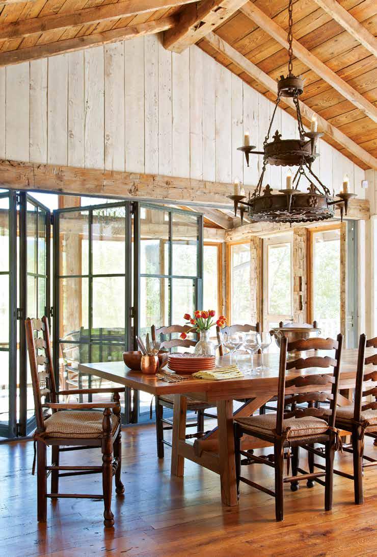 THIS PAGE: Custom steel windows and accordion doors to a screened porch bring the outdoors in.