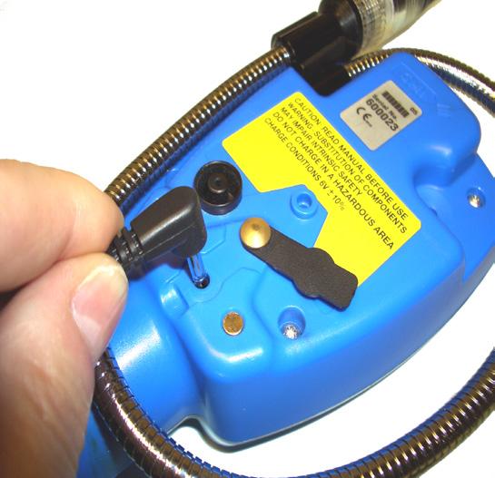 OPERATOR MAINTENANCE To connect Standard Charger to the instrument: 1) Lift dust cover from charger socket in rear face of instrument then connect charger plug, as shown in Fig. 13.17.