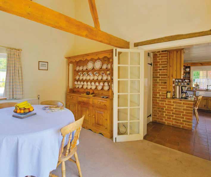 KITCHEN BREAKFAST ROOM 5.8m x 4.8m Multi pane windows to front and both side aspects. Original quarry tiled floor. Base and wall mounted hand-made units with granite worksurfaces.