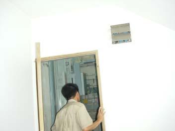 There is a wood door for maintenance of the pipe