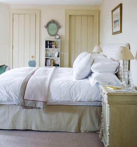 MAIN BEDROOM Soft colours create an air of elegance. Bed and bedding, The White Company. Throw, Volga Linen. Bedside table, Ann May & Daughter. BATHROOM Tongue-and-groove has a country feel.