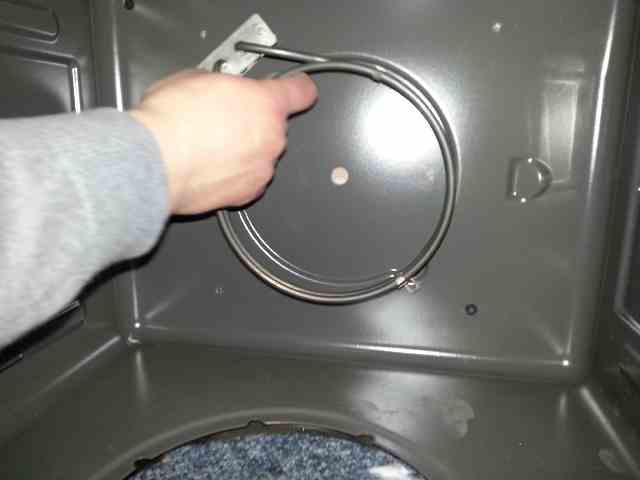 Inside the oven chamber, remove the screw