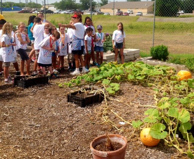 Host Mary Bowe greeted the children on behalf of Guadalupe County Master Gardeners (GCMG) and welcomed them to the community garden managed by Ann and Dale Odvody.