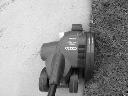 OPERATION (cont.) Switching ON For your safety the lawn edger is designed with a lock-off safety switch (1) and dual safety levers (3). If only one lever is squeezed, the lawn edger will not operate.