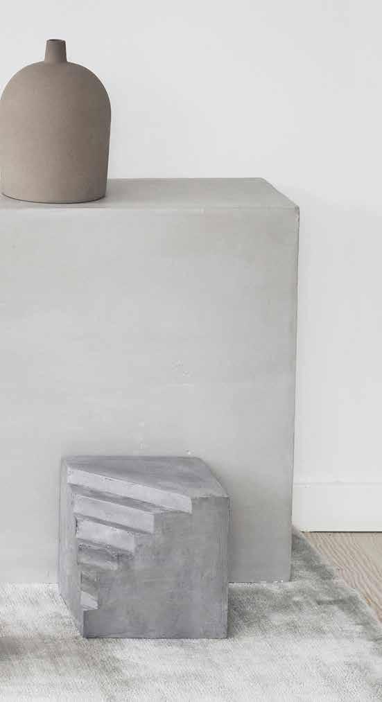 The concrete brings that urban feel into your living room - alluring, crude and with