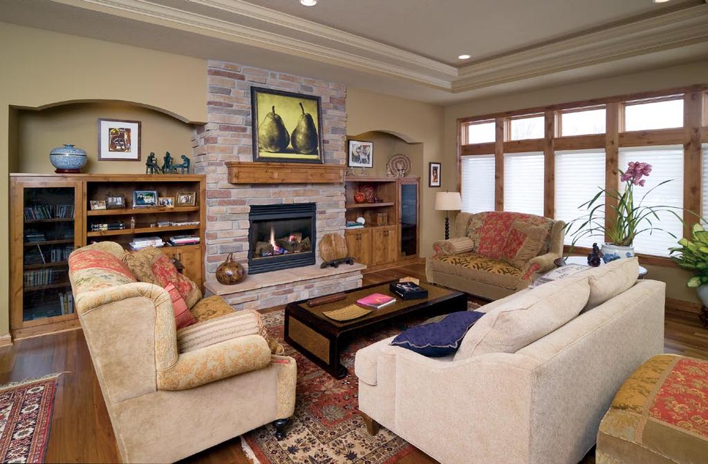 It s all in the details. Built-in bookcases topped by graceful arches surround the stone fireplace to create a focal point in the living room.