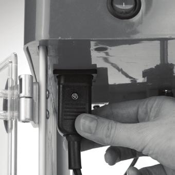 Holding the steel kettle at an angle, position the kettle inside the popper. Securely mount the notches on the kettle posts into the metal brackets inside the popper (Figure 1, step 1a).