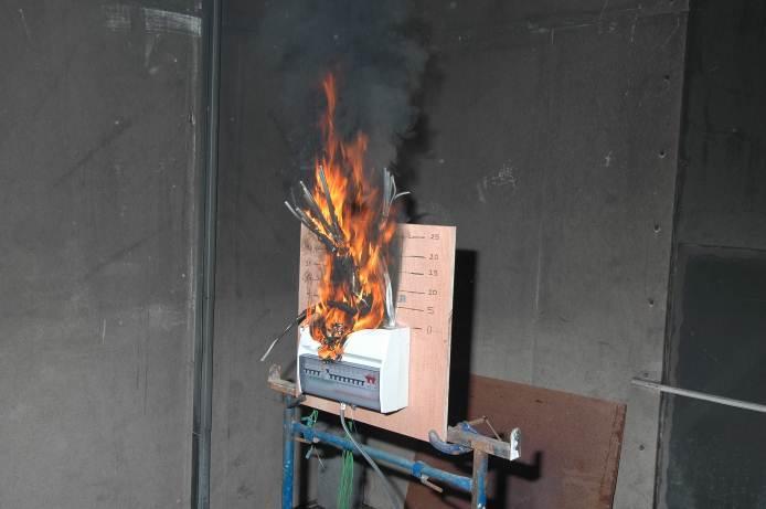 8 Research Report BD 2890 (E3V2) 293761 Figure 6 Plastic consumer unit on plywood backing board approximately 16 minutes into the experiment The fire was extinguished approximately 18 minutes into