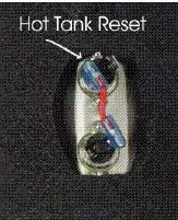 6. For demonstrative purposes, photos below have lowered the Hot Tank from the unit. Press the reset button 7.