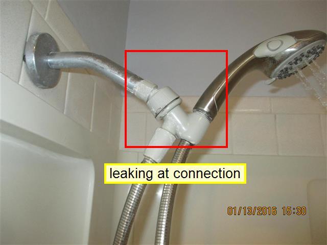 0 Item 1(Picture) (2) Shower head is leaking at connection.