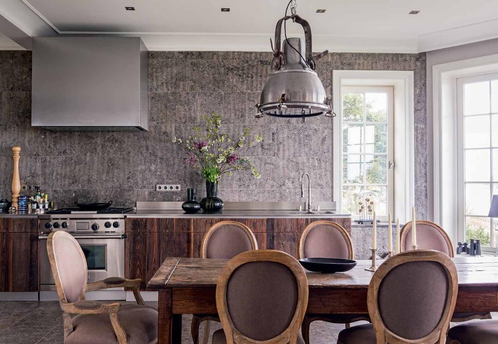 KITCHEN As we are by a river, I wanted a rustic finish for the cabinets, says homeowner Marion Geller.