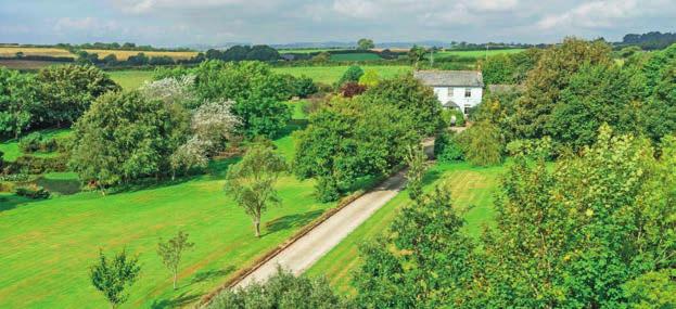The farmhouse is approached from Penventinue Lane over a long gravelled entrance driveway culminating in a large turning circle with distinct parking areas for farmhouse and cottages and a secondary